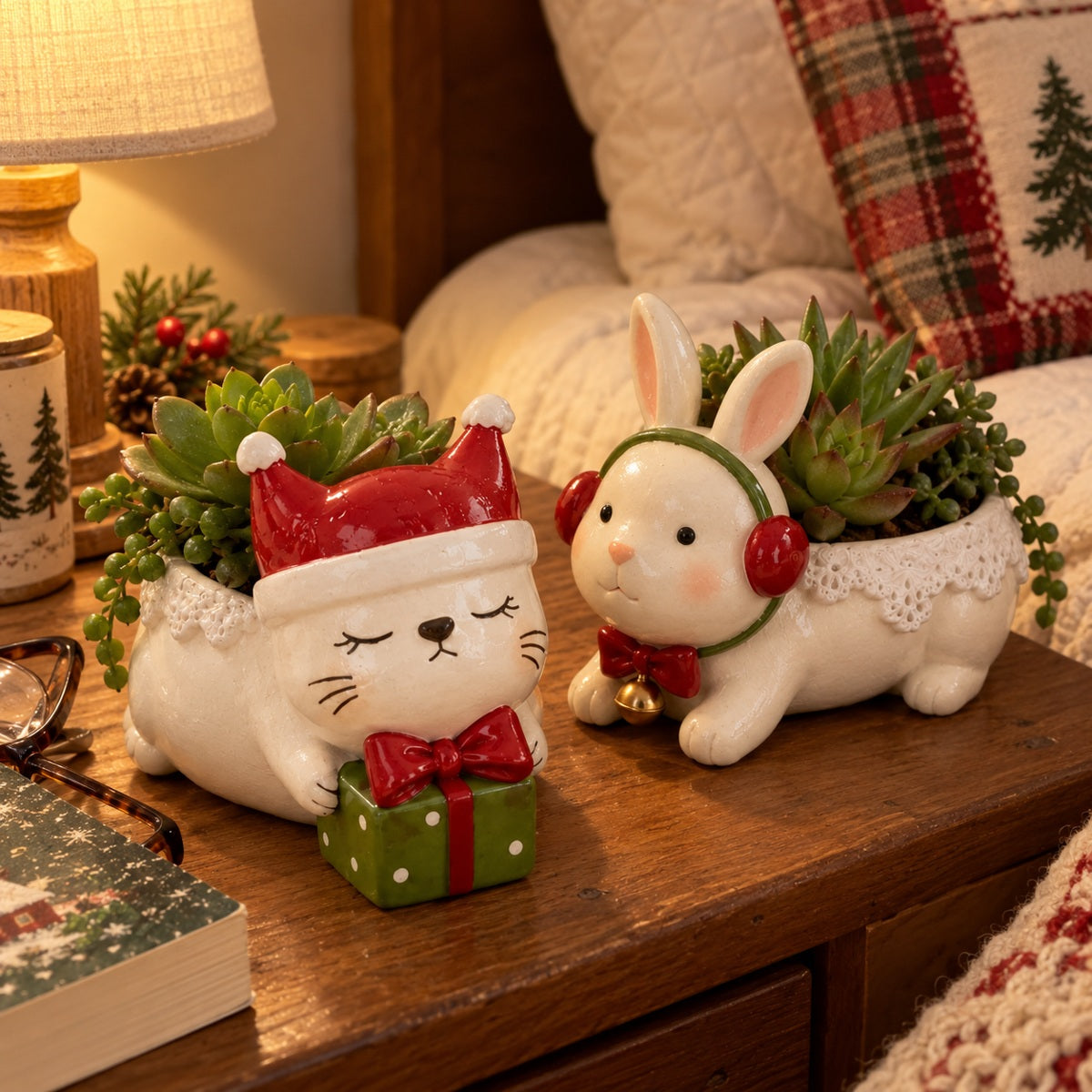 Bunny and kitty planters beside a warm table lamp