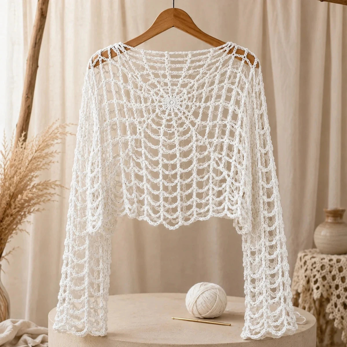 Finished webbed gothic crochet top hanging for display
