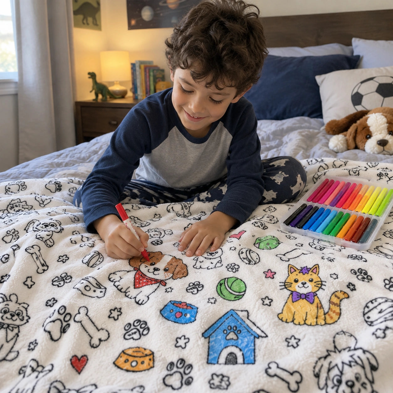 Child coloring the creative blanket on a bed