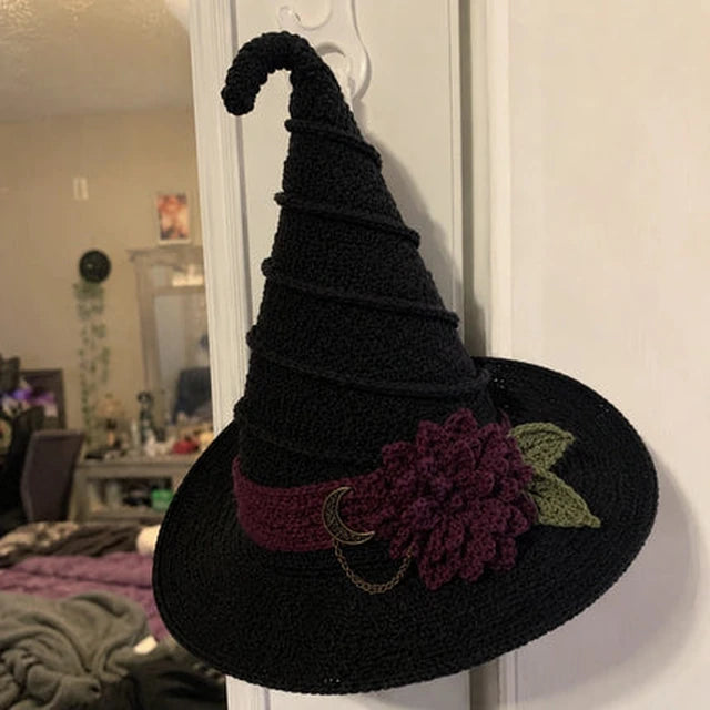 Black crochet witch hat displayed in a customer's home