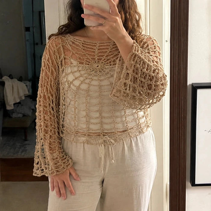 Customer mirror photo wearing a beige version of the webbed gothic top