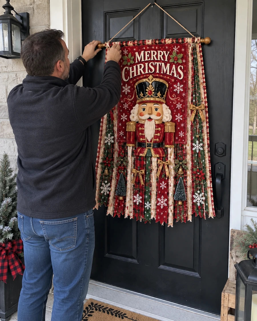 Real customer installing nutcracker Christmas banner on a black front door