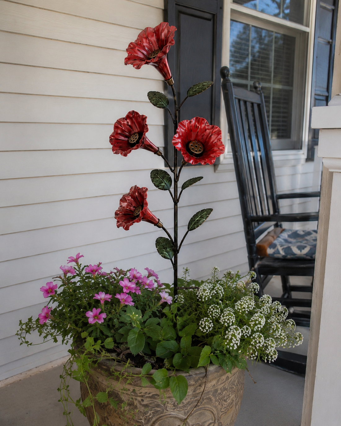 Poppy Red flower hummingbird feeder in a porch planter