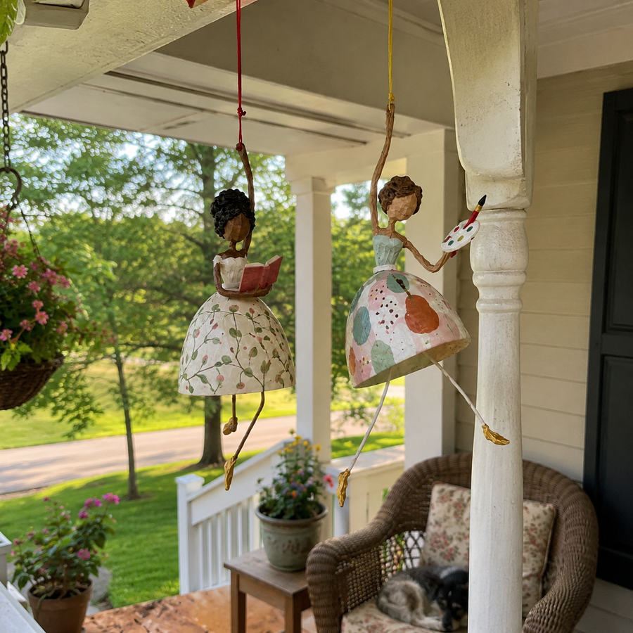 Reader and Artist hanging lady decorations displayed together on a covered porch