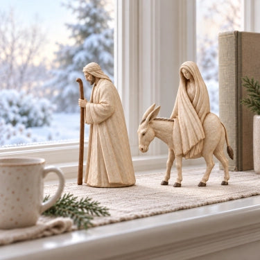 Nativity figurines by winter window