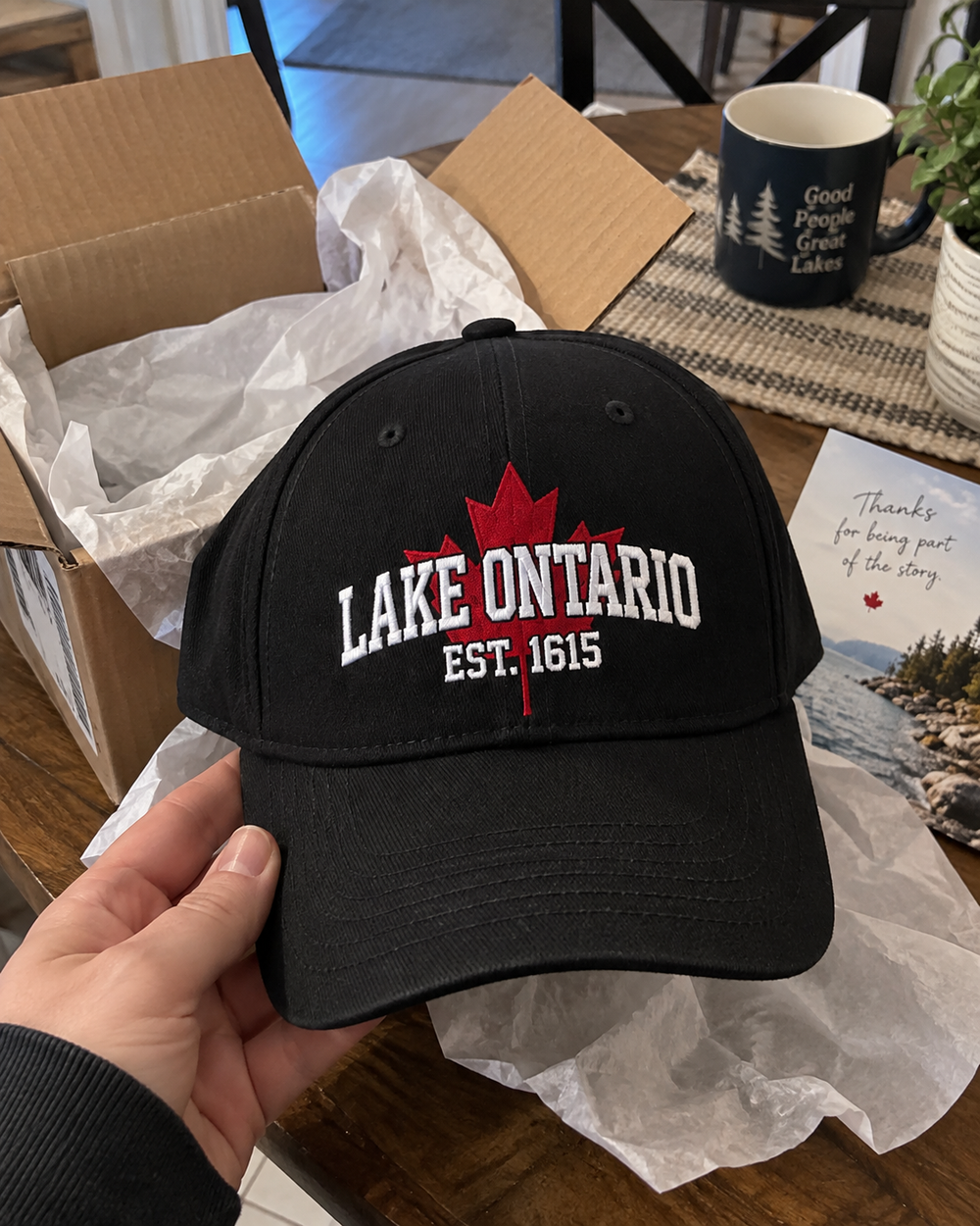 Customer unboxing Lake Ontario cap