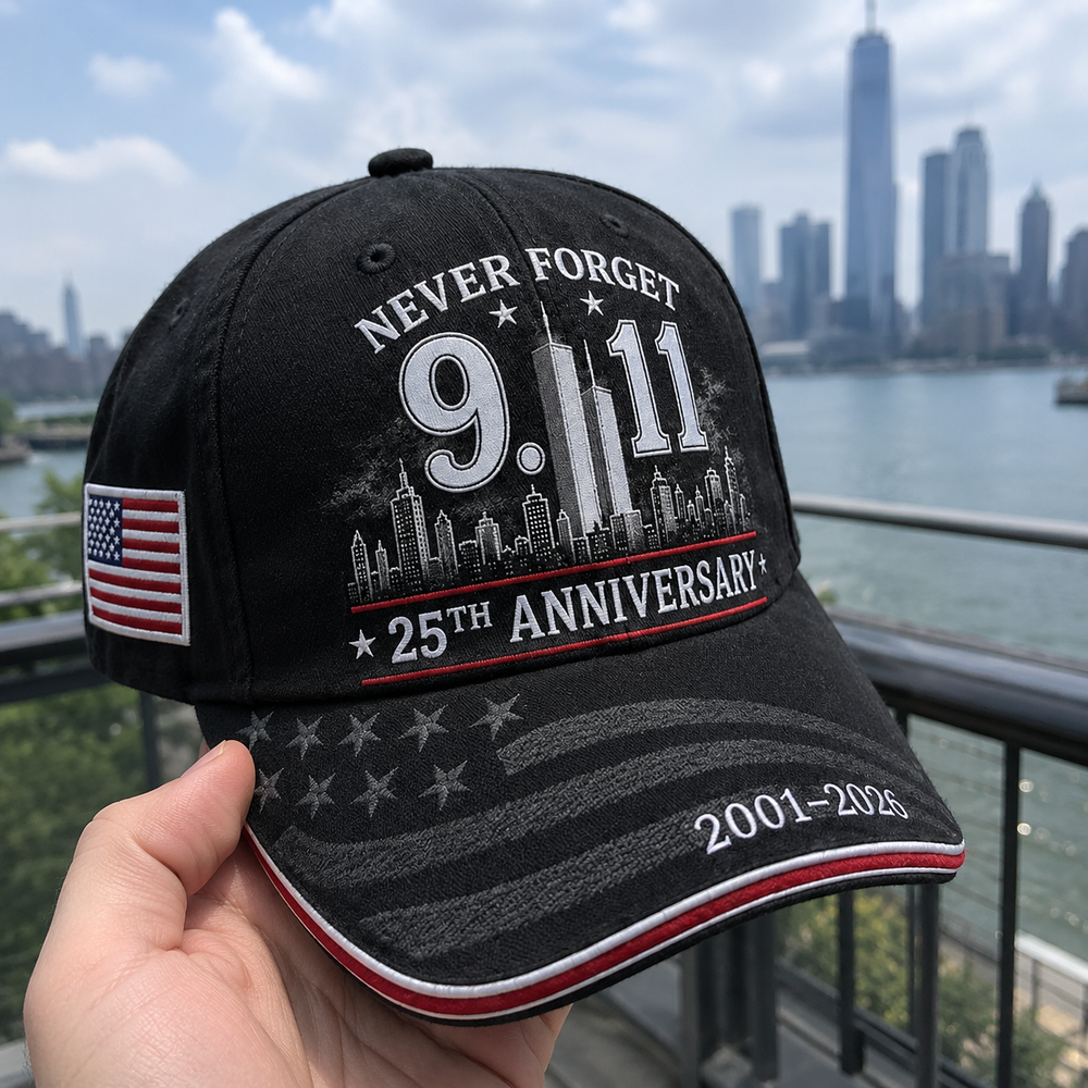Customer holding black 9.11 memorial cap outdoors