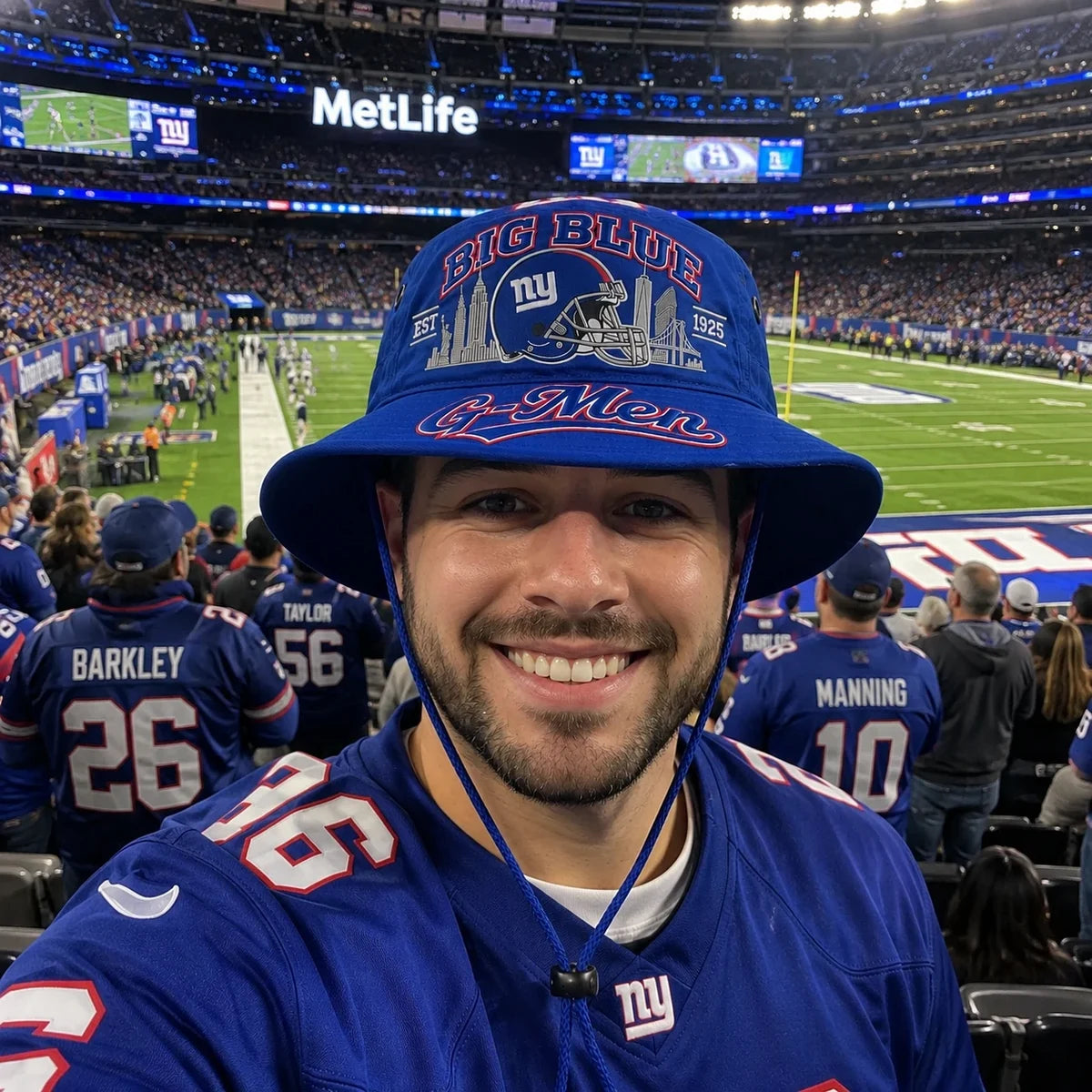 Man wearing the blue football boonie hat inside a stadium