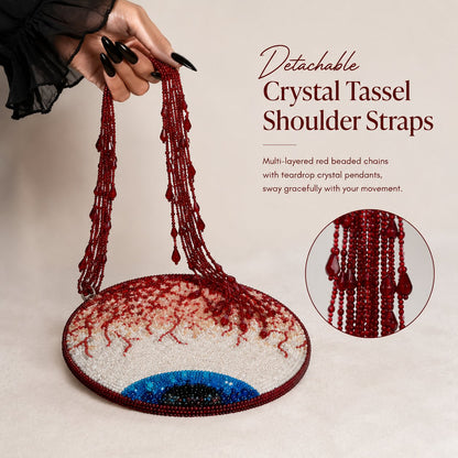 Hand-beaded round handbag featuring a bloodshot eyeball design.