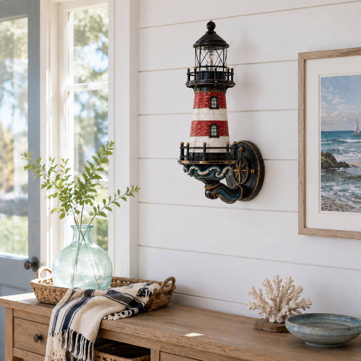 Lighthouse wall light styled above a coastal cottage entryway table