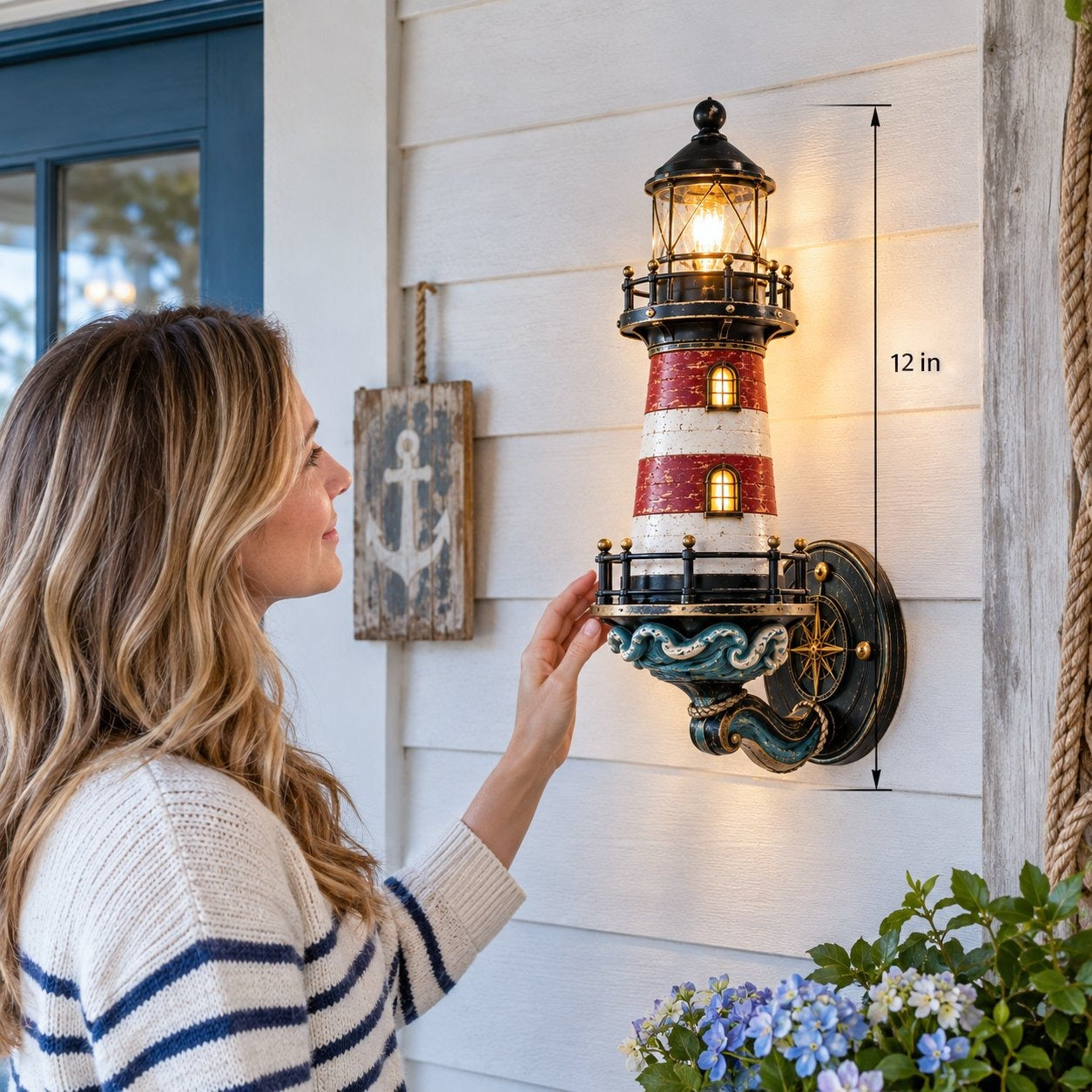 Woman beside the approximately 12 inch lighthouse wall light for scale