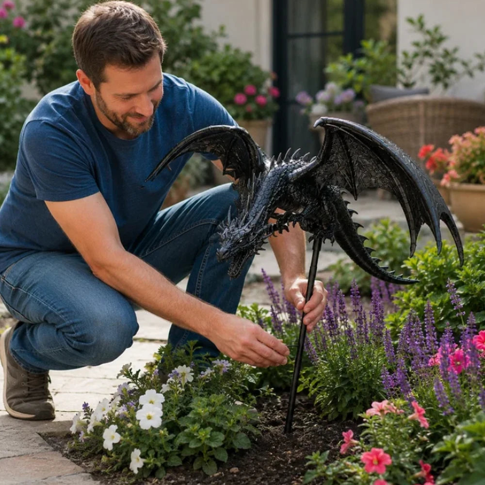 Installing the dragon light stake into a flower bed