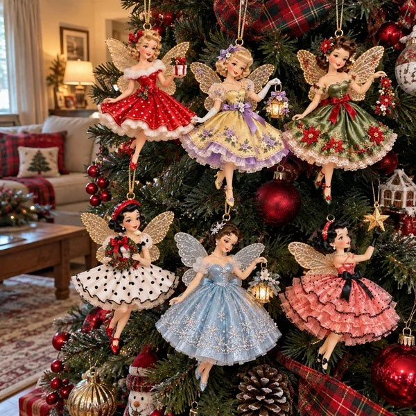 Five fairy Christmas ornaments styled as a group on a tree