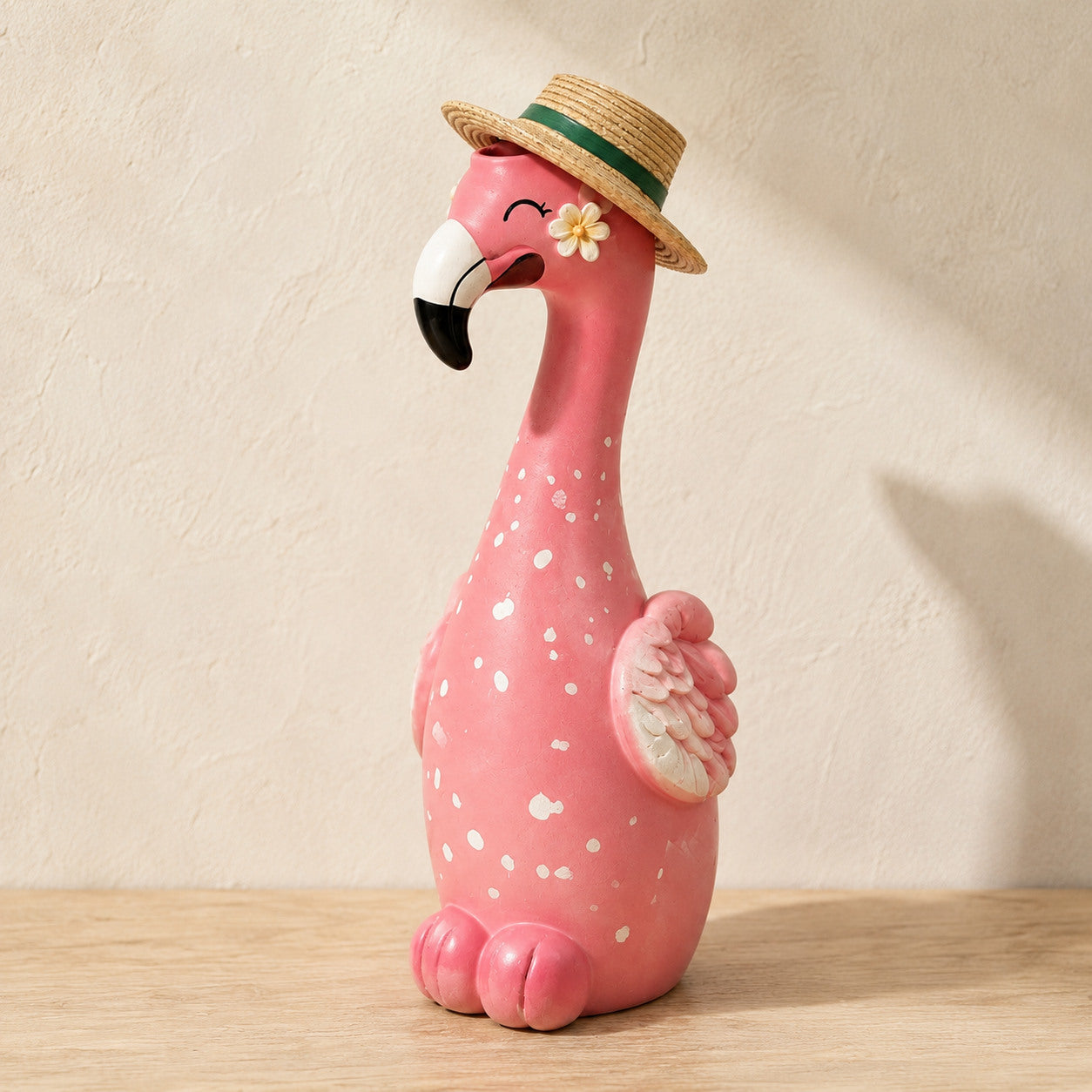 Close view of the painted details on a pink flamingo vase
