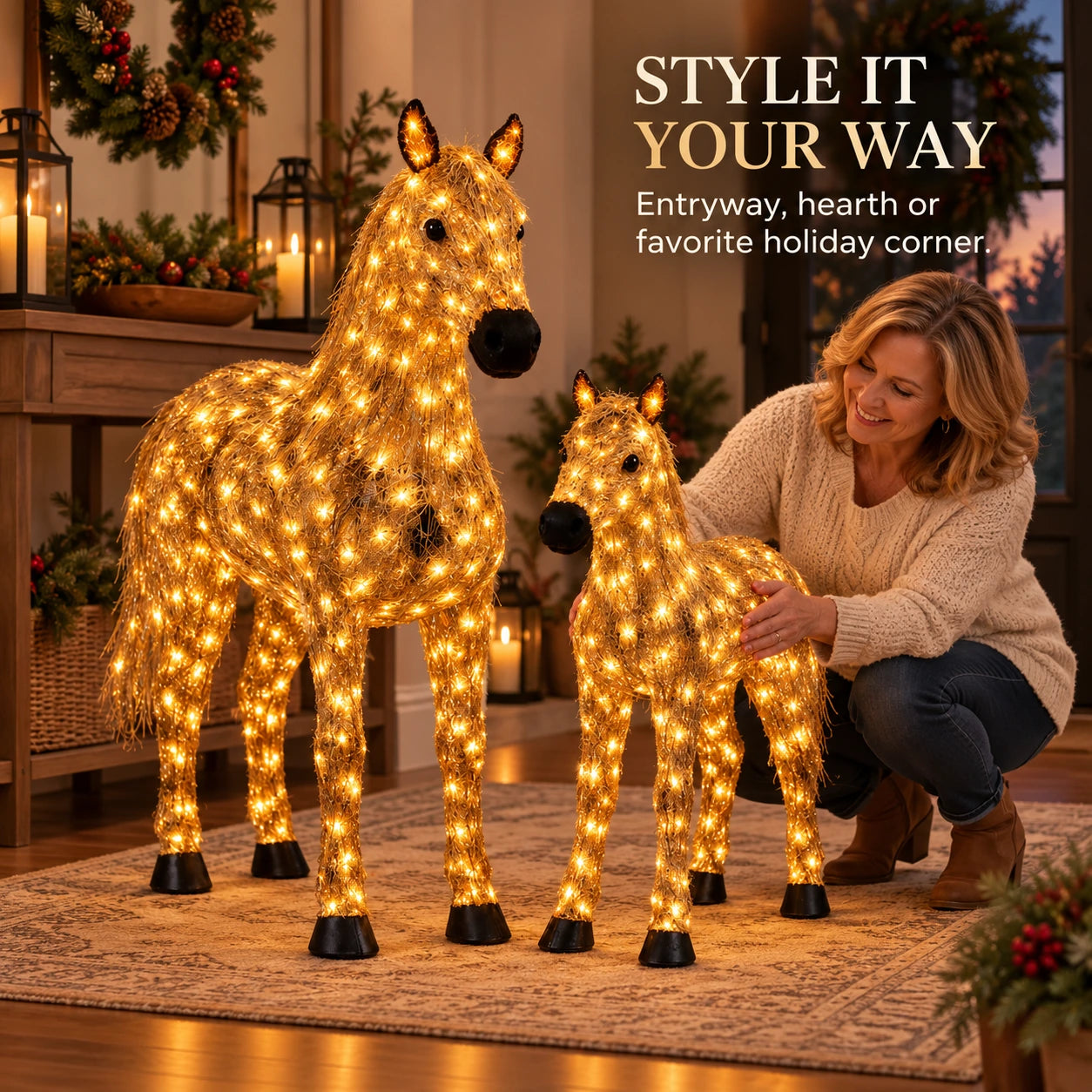 Woman styling the illuminated horse pair in a decorated holiday room