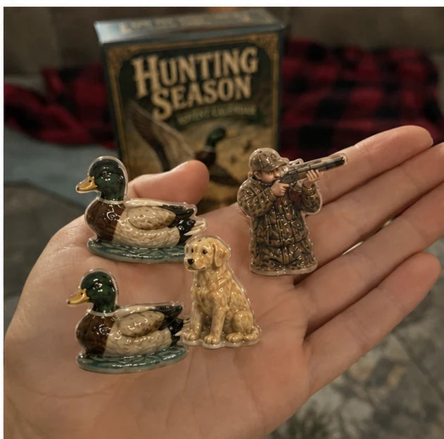 Hunting themed collectible pieces shown by hand