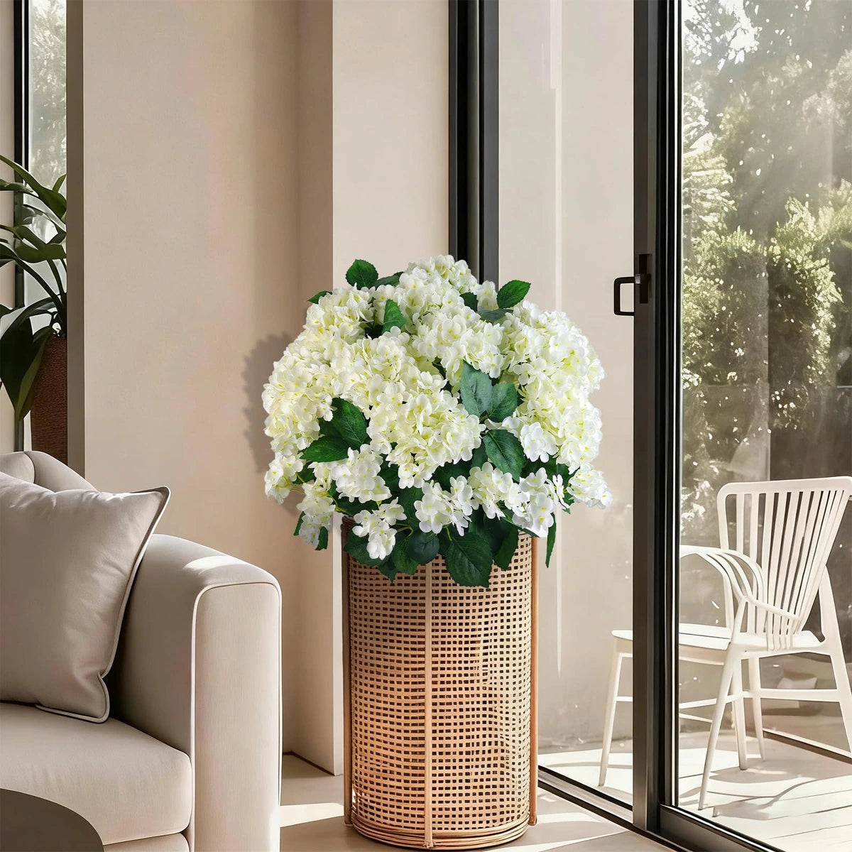White artificial hydrangea flowers styled indoors