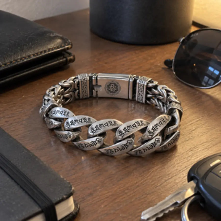 Engraved silver-tone bracelet with everyday desk essentials
