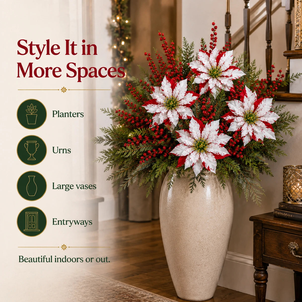 Christmas poinsettia picks styled in a large indoor entryway vase