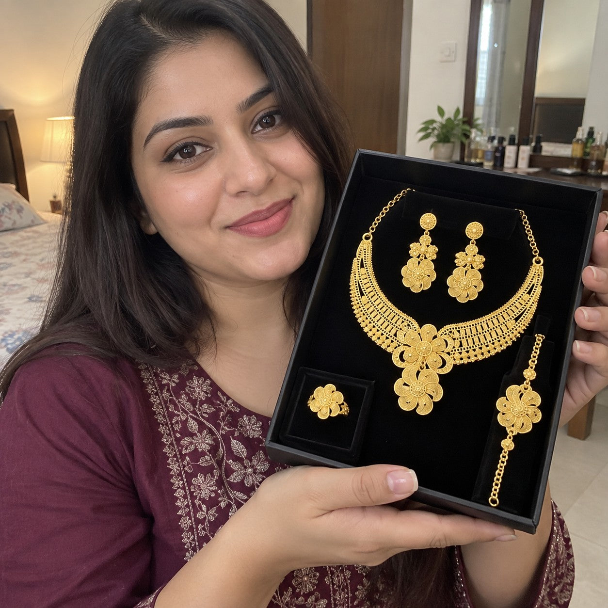 Customer holding the jewelry set in packaging