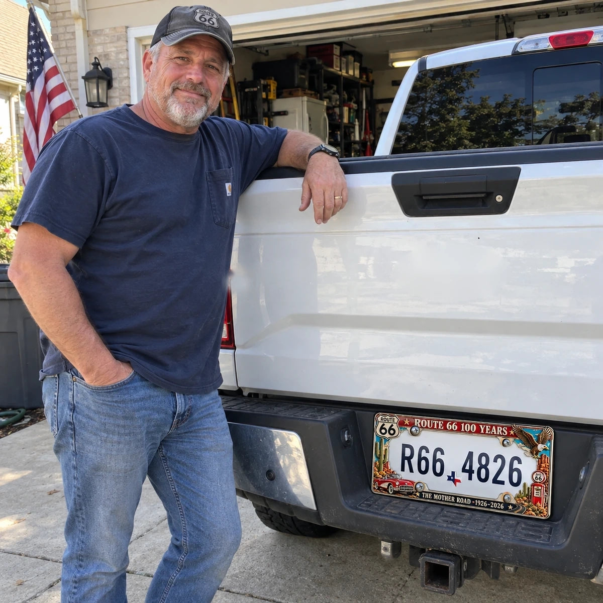 Pickup owner standing beside his truck with Route 66 commemorative frame