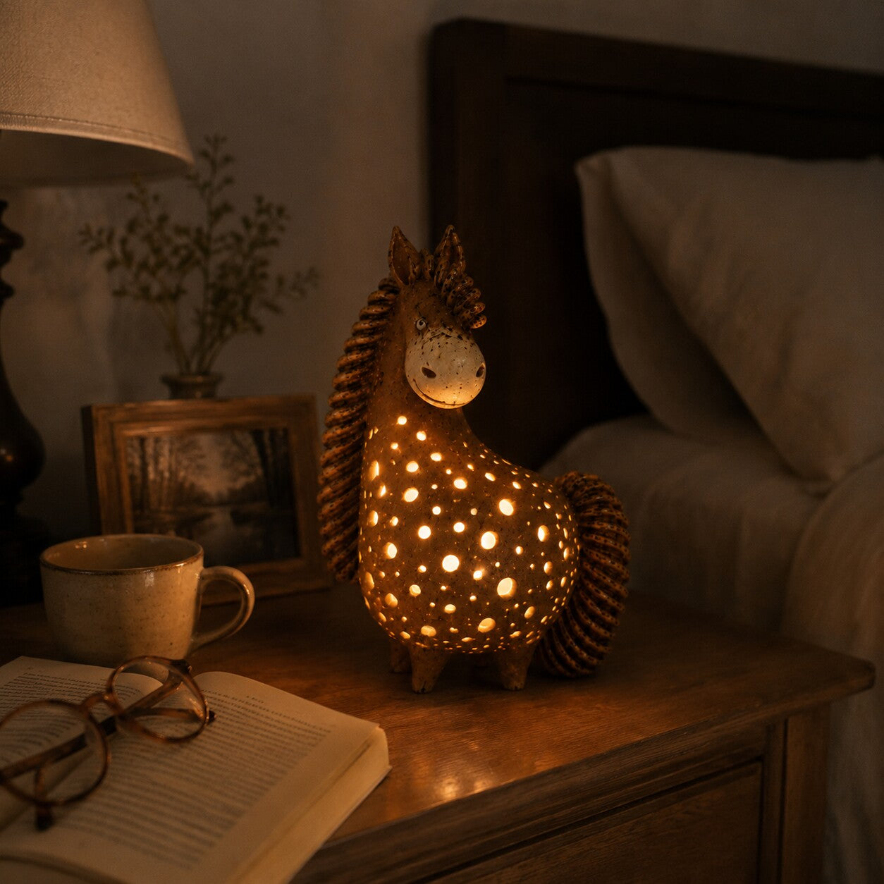 Customer's glowing horse accent light on a bedside table
