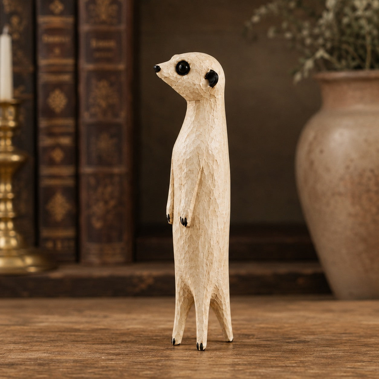 Close view of the carved wood texture on a meerkat sculpture