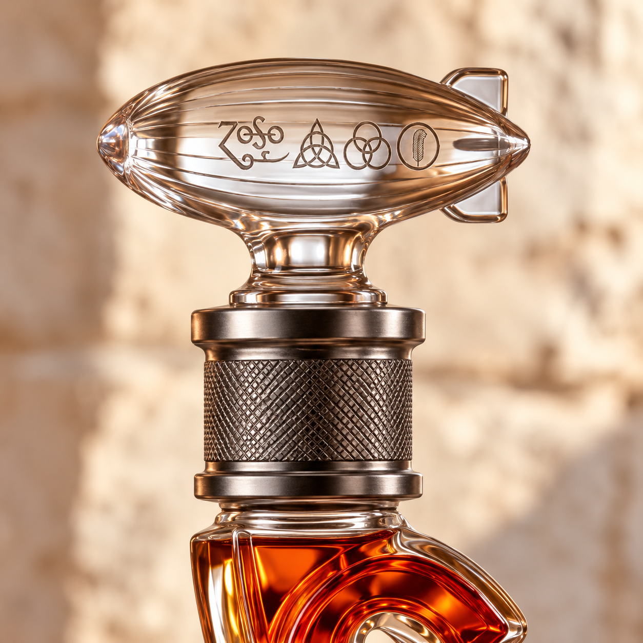 Detailed view of the glass airship stopper and textured decanter neck